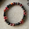 Pulsera masculina creada con Turmalina negra y Turmalina roja, Ojo de Buey y anillos de Hematita 2