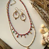 Conjunto de collar doble y aros elaborado con cristales facetados de Rubí rosado y circonitas moradas 1