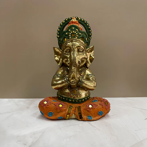 Ganesha dorado con naranja