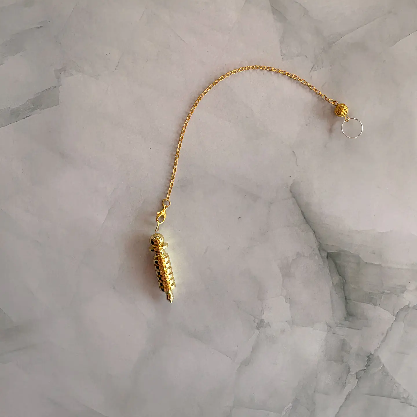 Péndulo metalico dorado 1