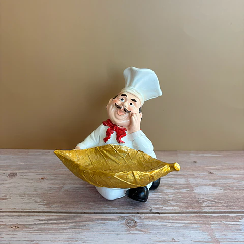 Figura chef con hoja dorada
