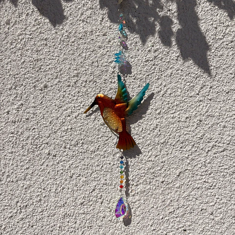 Atrapasoles con colibrí