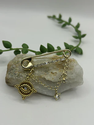 Prendedor ojo protector 