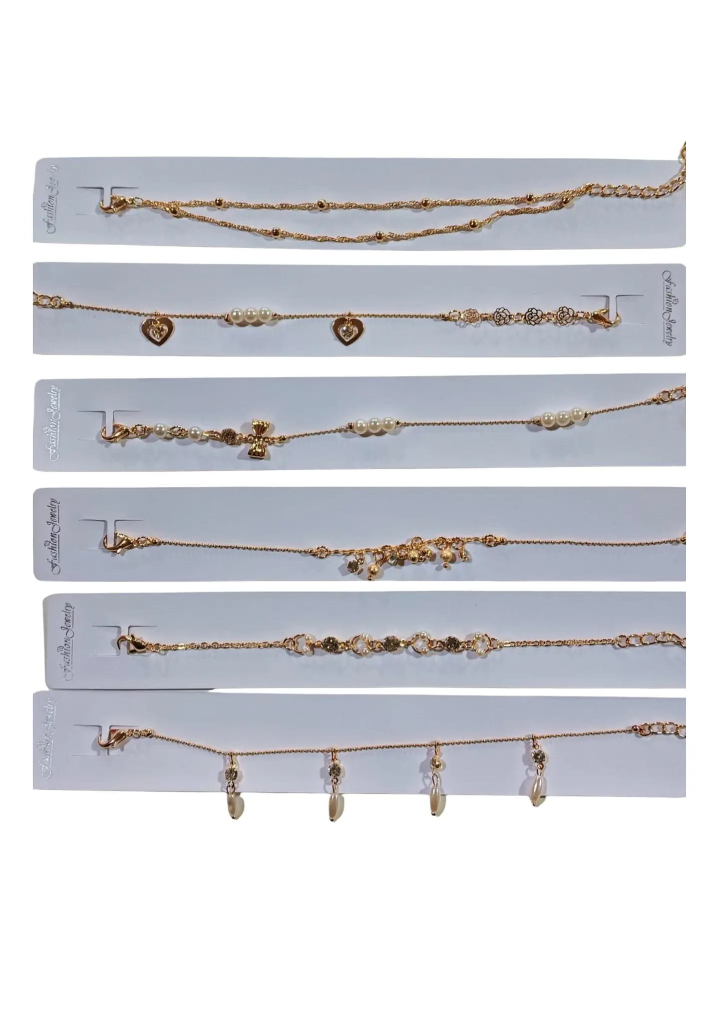 PULSERA PERLA Y DIJES 1