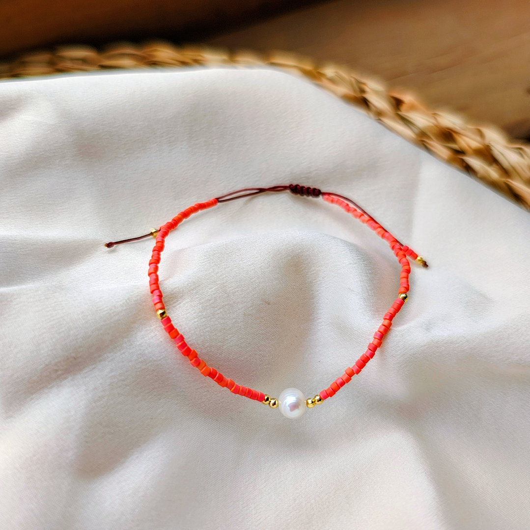 Pulsera naranja una perla 1