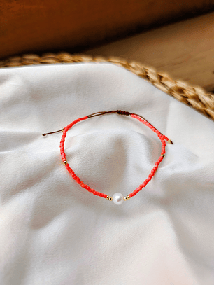 Pulsera naranja una perla