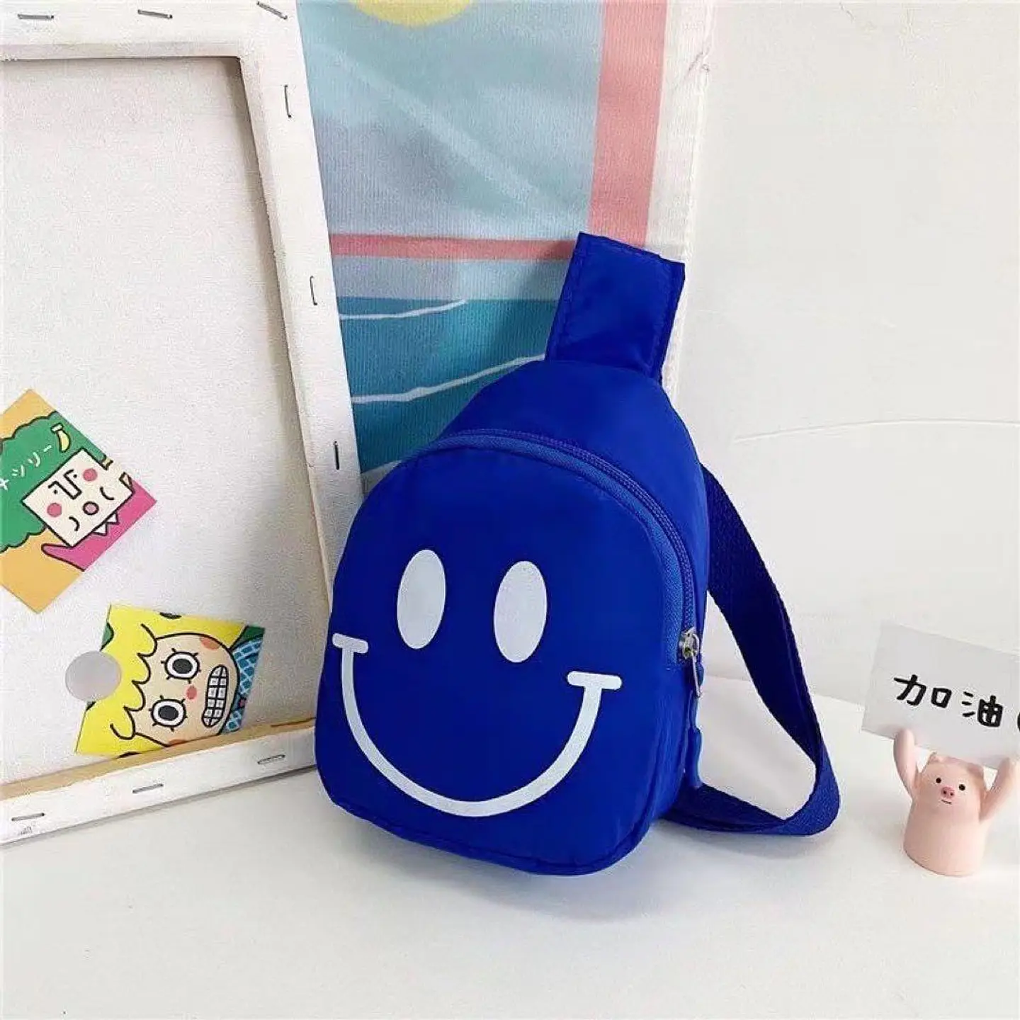 Mini Mochila Bandolera Infantil Azul con Carita Feliz 1