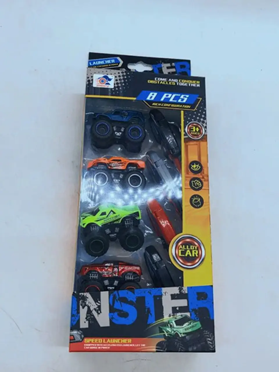 Set De Monster Trucks Metálicos Con Lanzador 8 Piezas 1