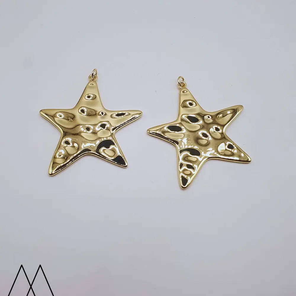 Colgante Estrella dorado, con argolla 50mm