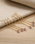 AROS COLGANTES RAY MORADO BAÑADO EN ORO 18K