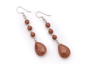 Aros de piedra del sol y detalles de plata