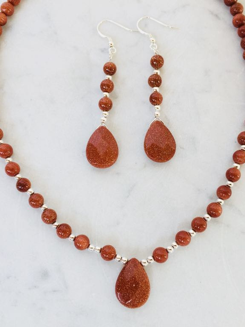 Aros de piedra del sol y detalles de plata 3