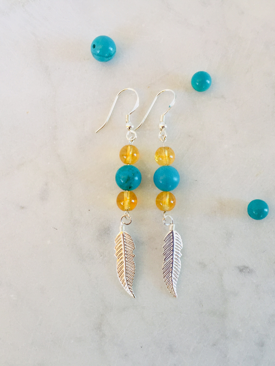 Aros pluma de plata con piedras citrino y turquesa 1