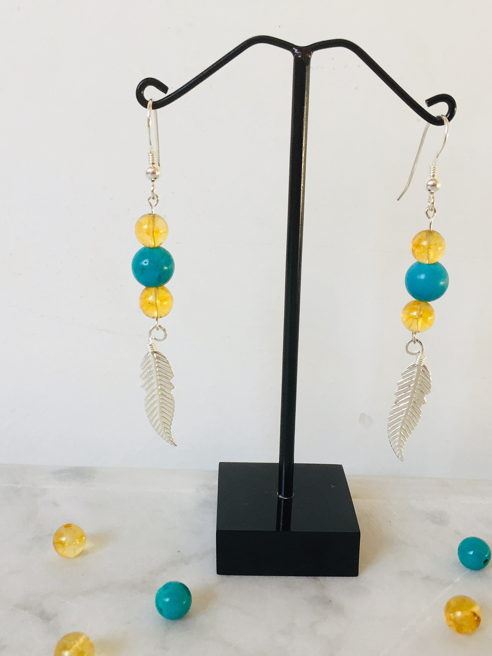 Aros pluma de plata con piedras citrino y turquesa 2