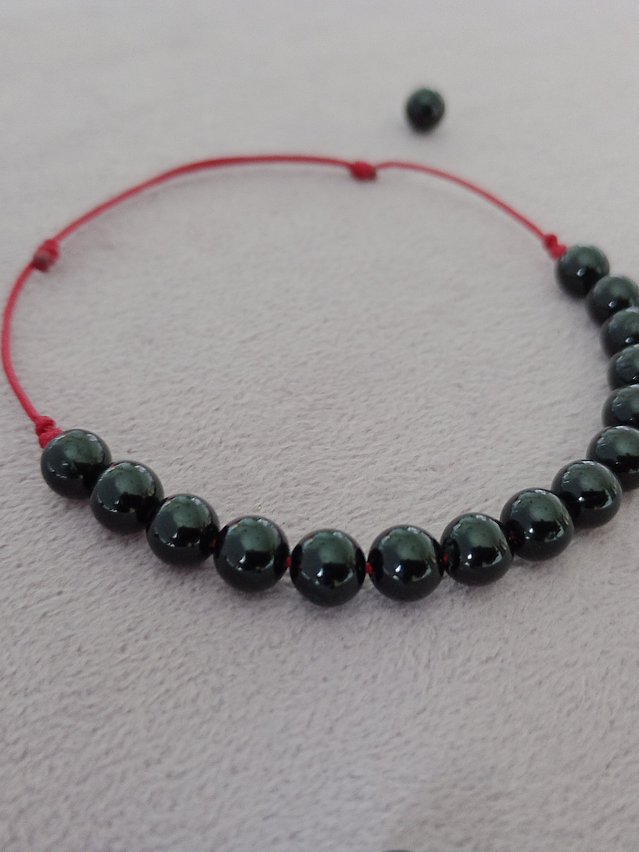 Pulsera hilo rojo regulable de piedras turmalina 1