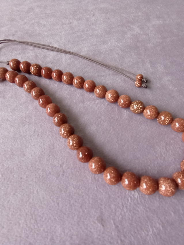 Conjunto de collar de hilo regulable y aros de piedra del sol 7