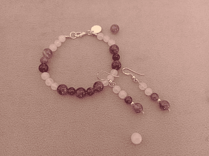 Conjunto de pulsera y aros de piedras cuarzo rosa y amatista