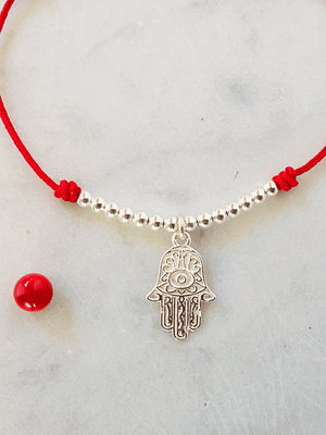 Pulsera de hilo regulable con mano de Fátima y detalles de plata 