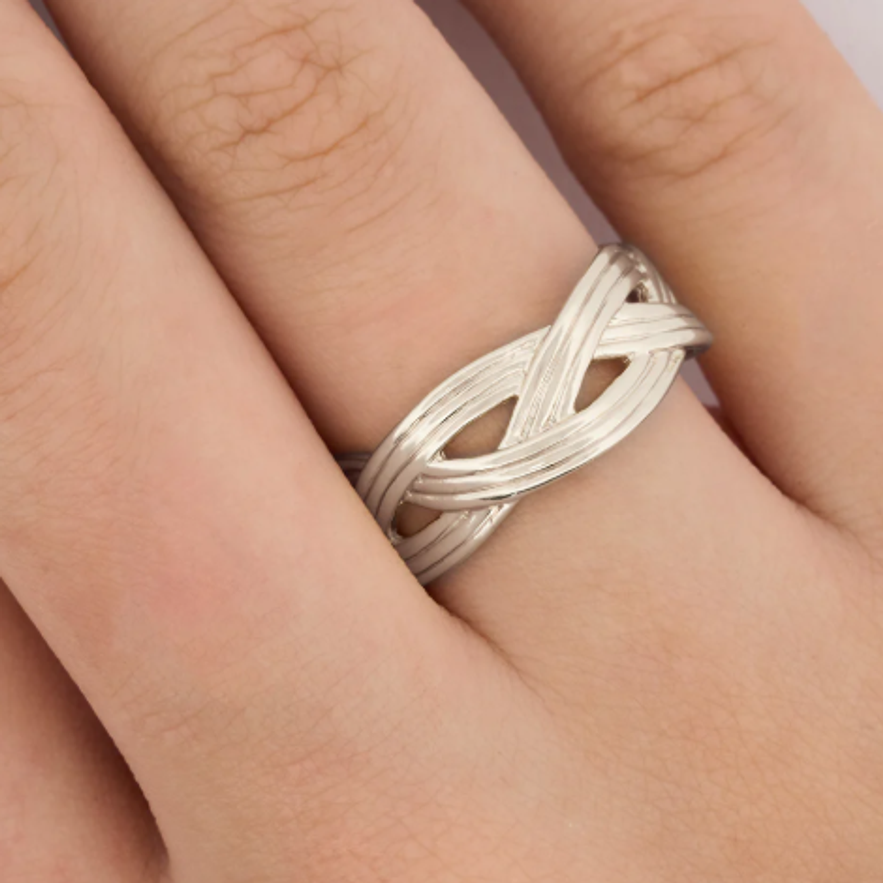 ANILLO CRUZADO PLATEADO