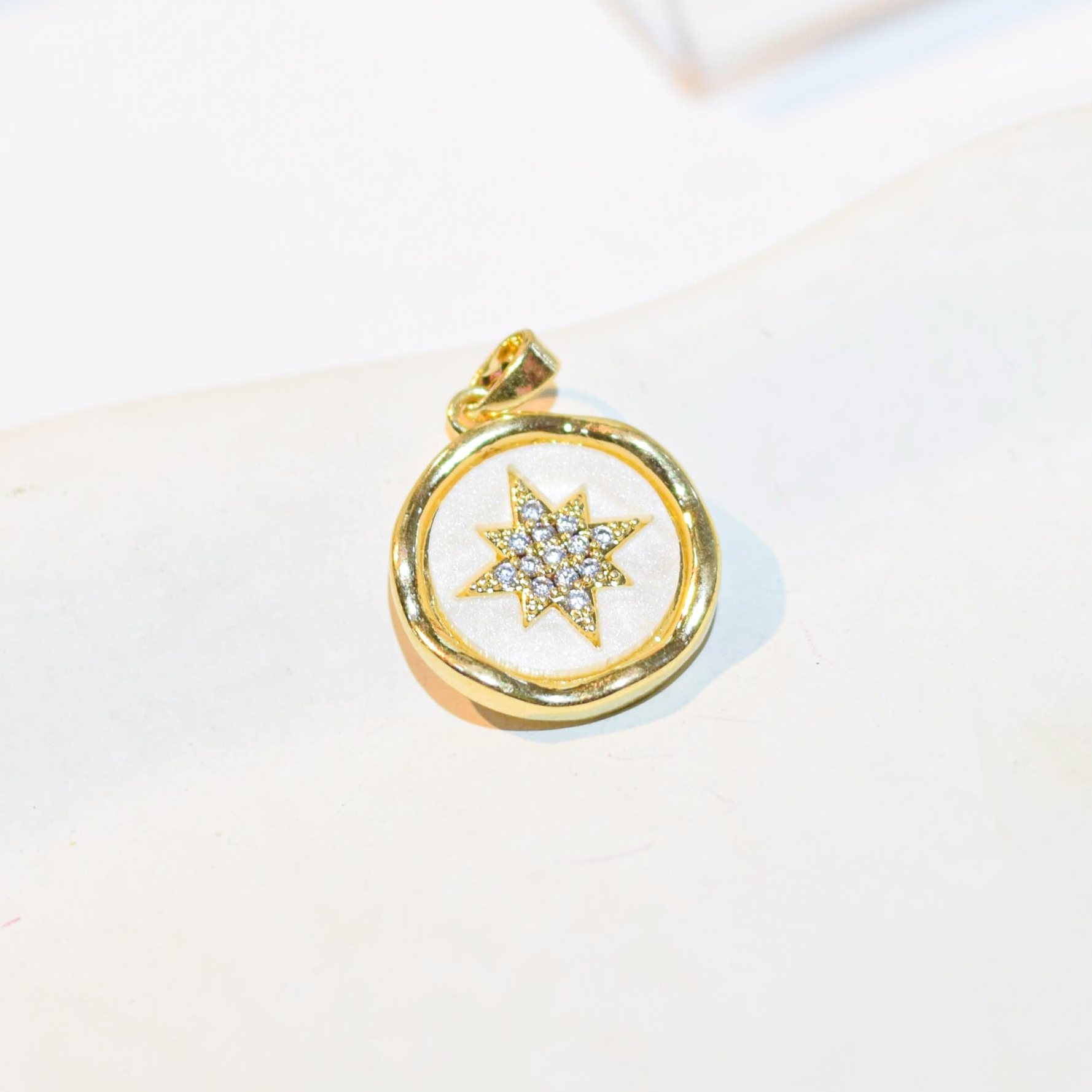 DIJE MEDALLA ESTRELLA CIRCONES