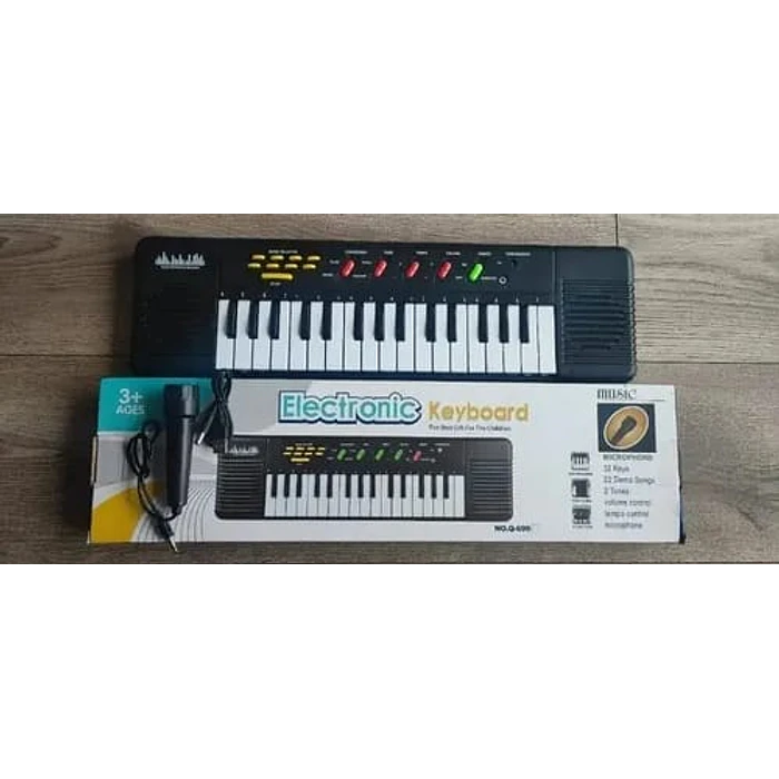 TECLADO PIANO ORGANO MUSICAL INFANTIL A PILA 2