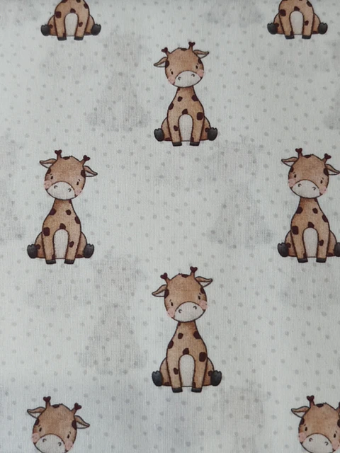 Tela  con estampado de jirafas 