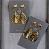 Aros Pluma colgante baño Oro