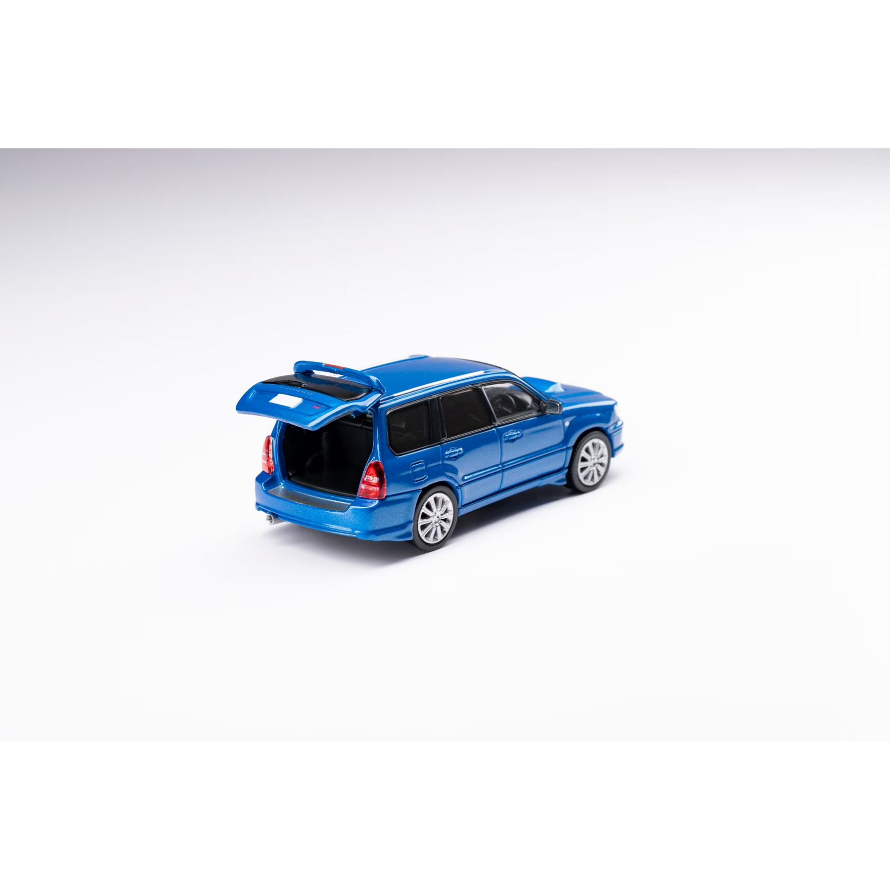 Model Model 1:64 Subaru Forester SG9 Sti blue.
