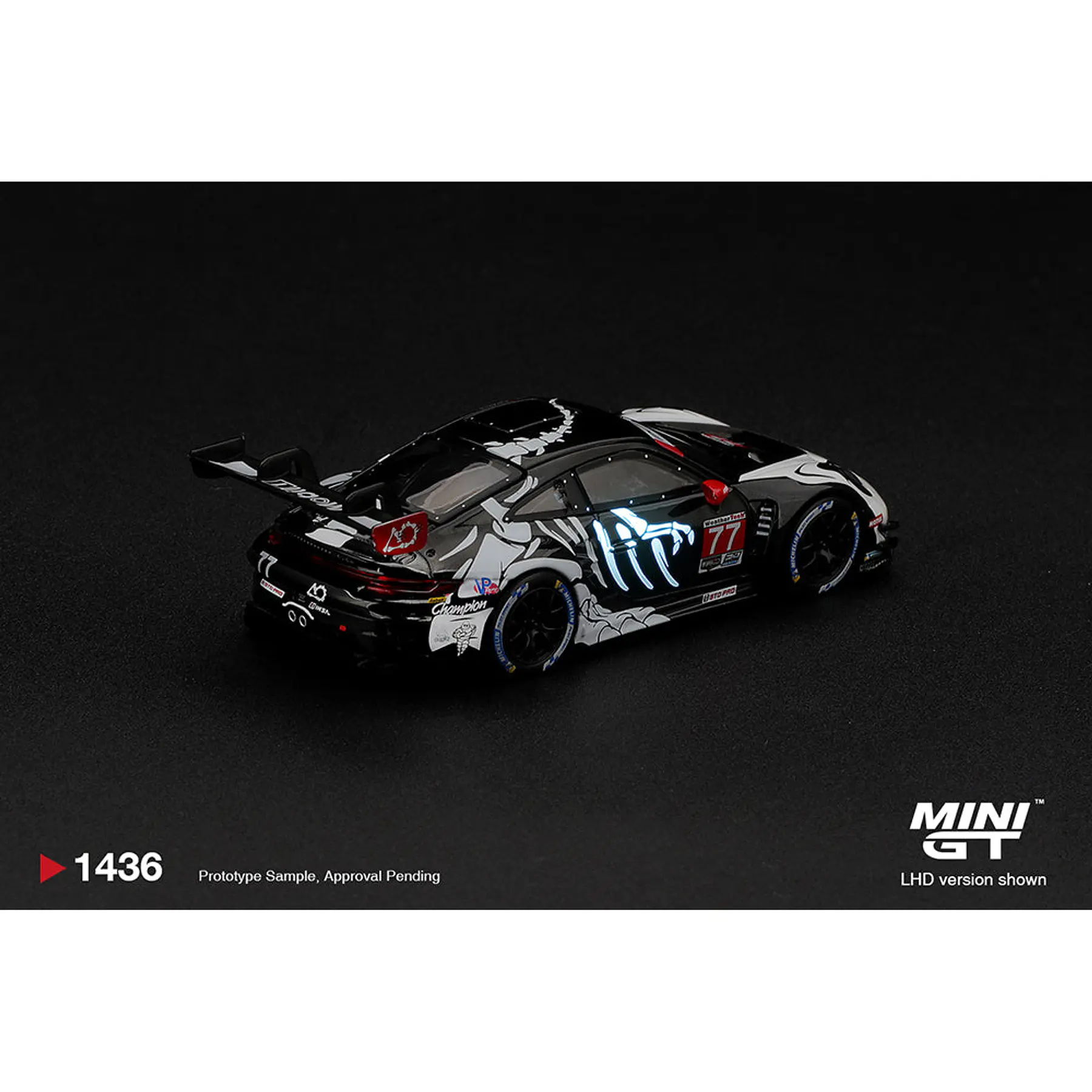 (PREVENTA) Mini GT 1:64 Porsche 911 GT3 R (992) #77 AO Racing “Skeleton Rexy” 2026 IMSA Petit Le Mans – (Glow in the Dark) – Limited Edition