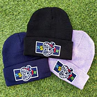 EL ASOMBROSO CIRCO DIGITAL - CENSURA CAINE Beanie 1