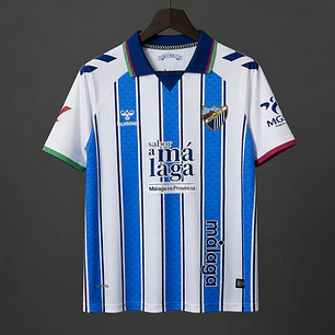CAMISA MÁLAGA CF 26/27 PRINCIPAL - Azul e Branca Listrada