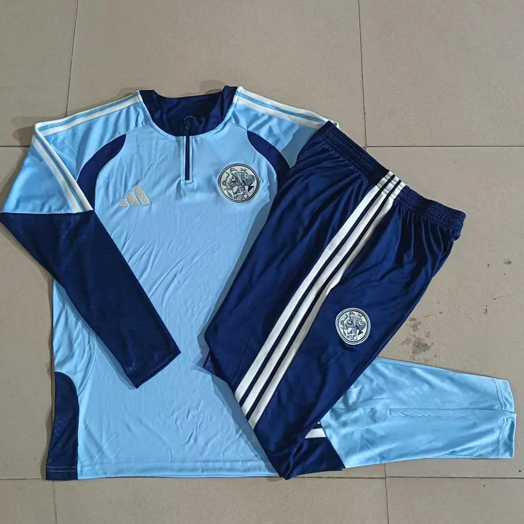 CONJUNTO DE TREINO AJAX 26/27 - MEIO ZÍPER - Azul Claro e Azul-Marinho 1