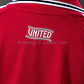 CONJUNTO INFANTIL MANCHESTER UNITED 26/27 CASA - Thumbnail 3