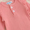 Conjunto pilucho, pantalones y cintillo flores rosadas