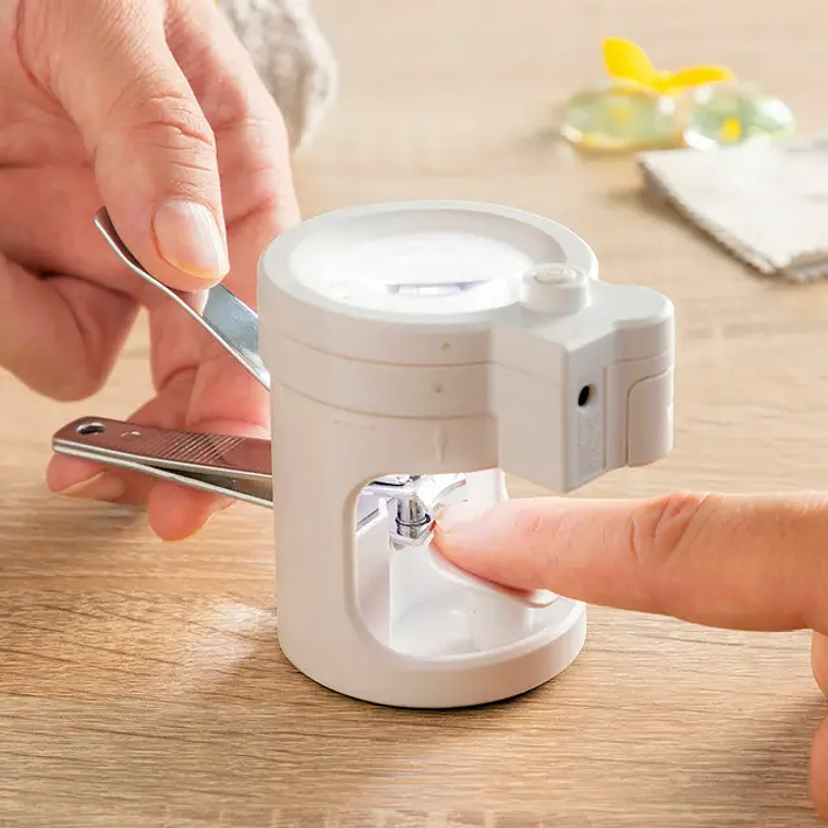 Nail clipper with LED light and 8x magnifying glass - Includes nail file, non-slip base, and battery/USB powered. 4