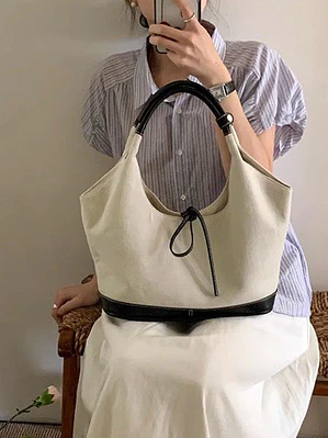 Bolso tote de lona con ribete de cuero sintético y detalle de lazo — estilo minimalista