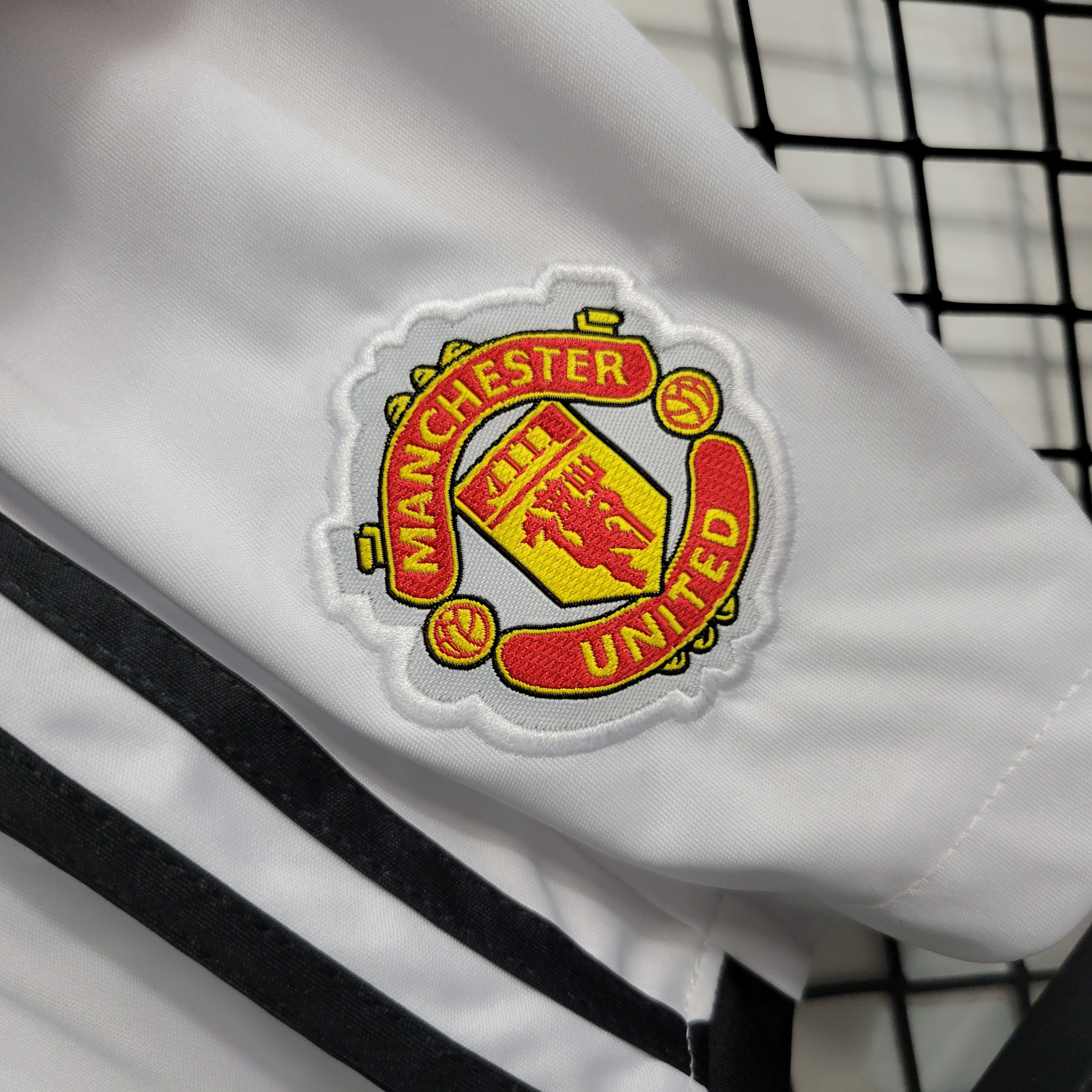 KIT CRIANÇA MANCHESTER UNITED HOME 23-24 3