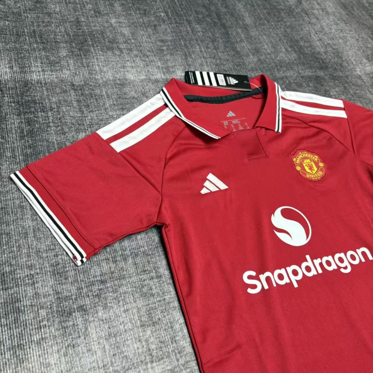 Kit Criança Manchester United principal 26/27 6