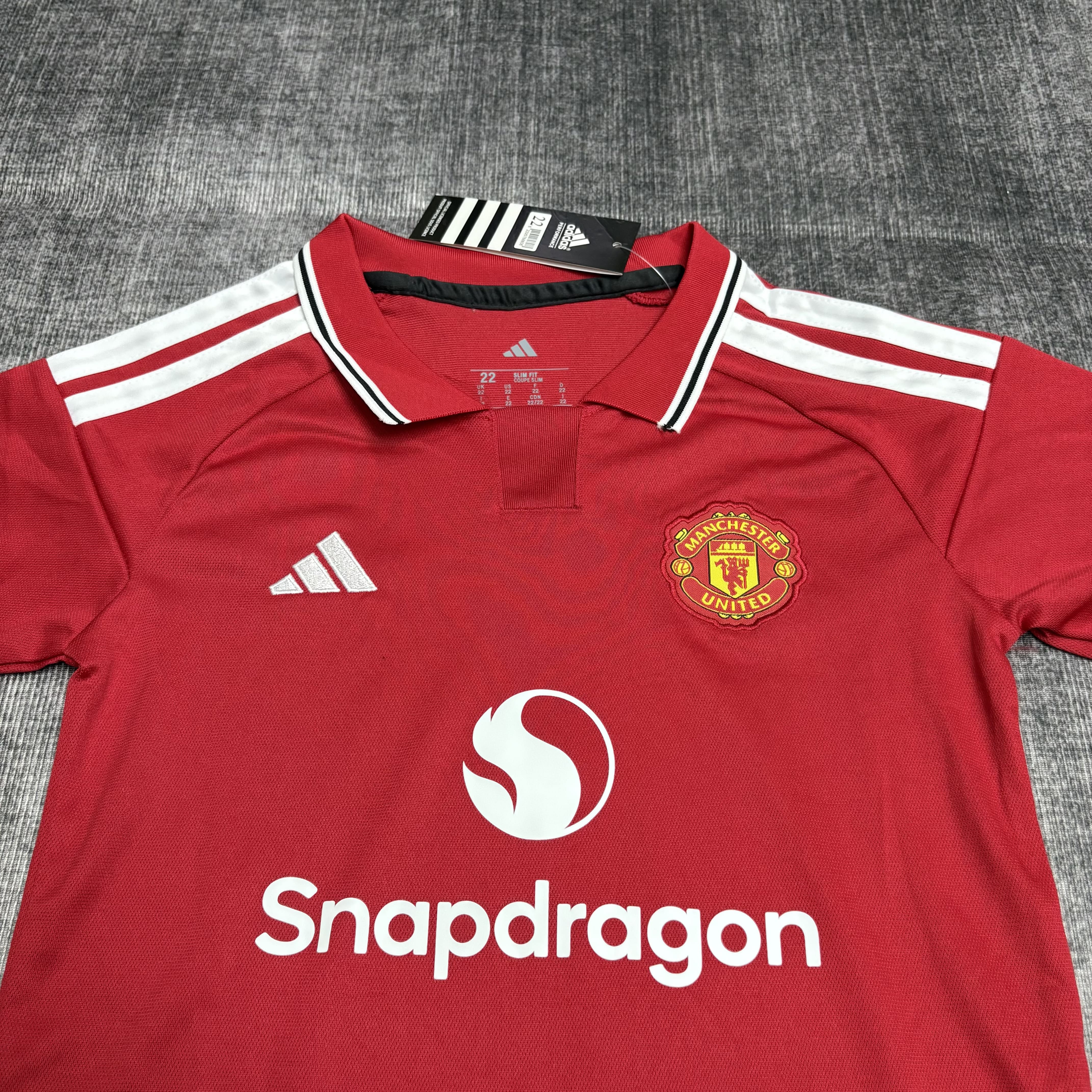 Kit Criança Manchester United principal 26/27 5