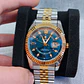 Relógio Luxuoso em aço 316 L Prata e Dourado sobre Azul. - Thumbnail 1