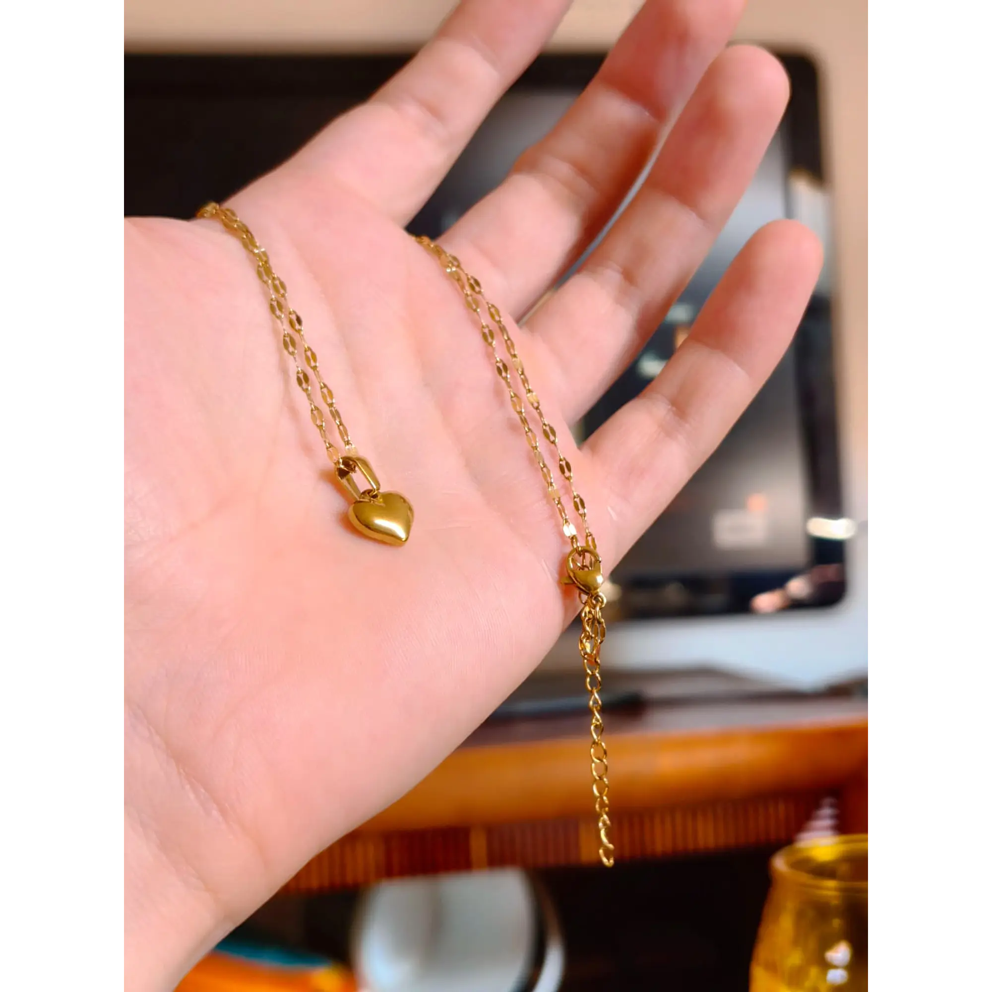 Delicate necklace with a gold heart pendant. 4