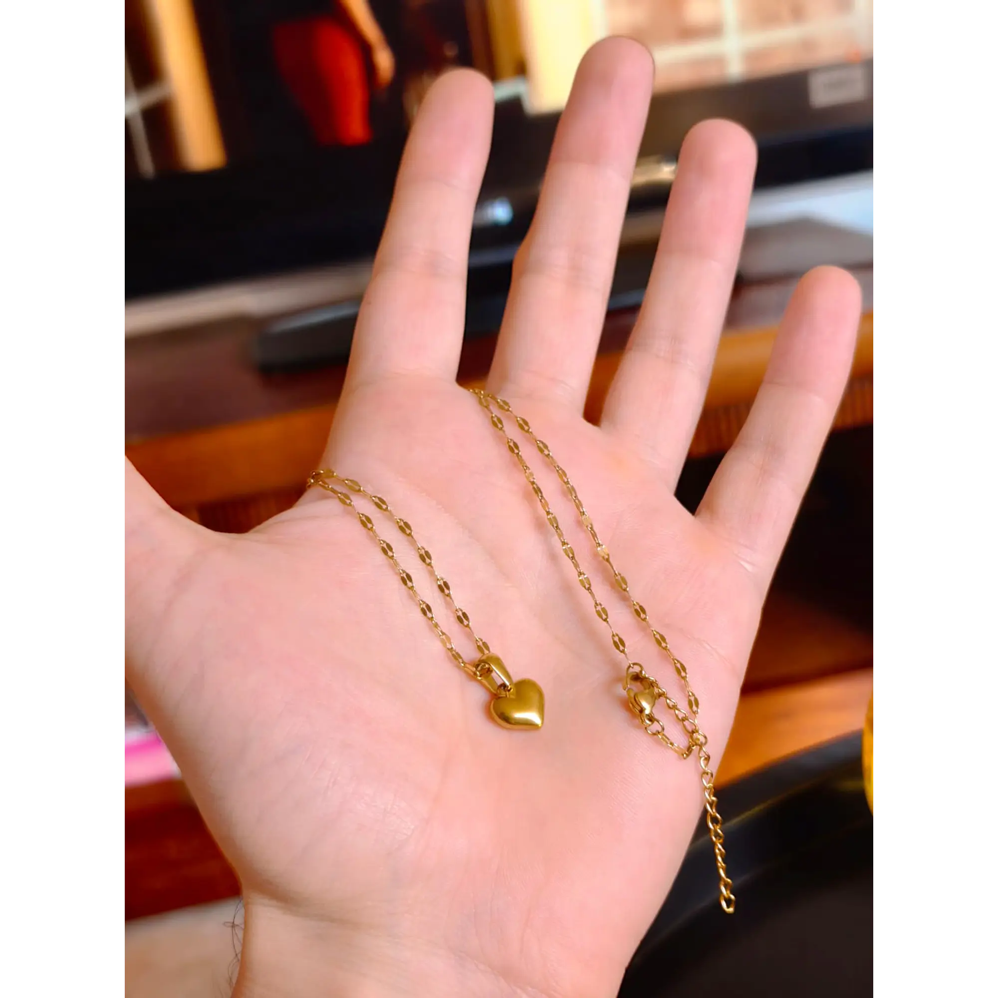 Delicate necklace with a gold heart pendant. 1