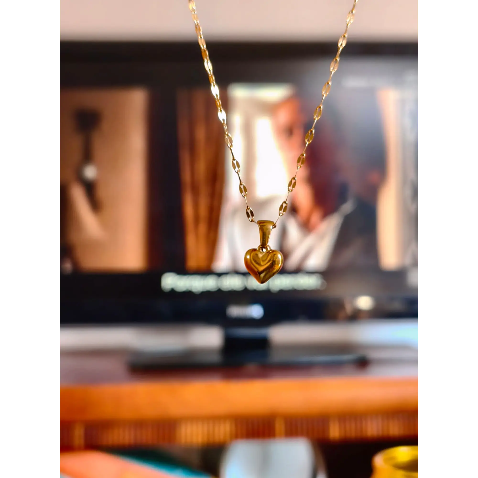 Delicate necklace with a gold heart pendant. 5