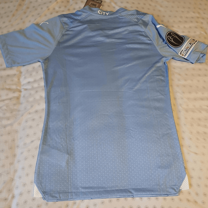 Camiseta  Manchester City  F. C.  Hombre Local  23/24 Versión Jugador con Parche UCL  Talla 