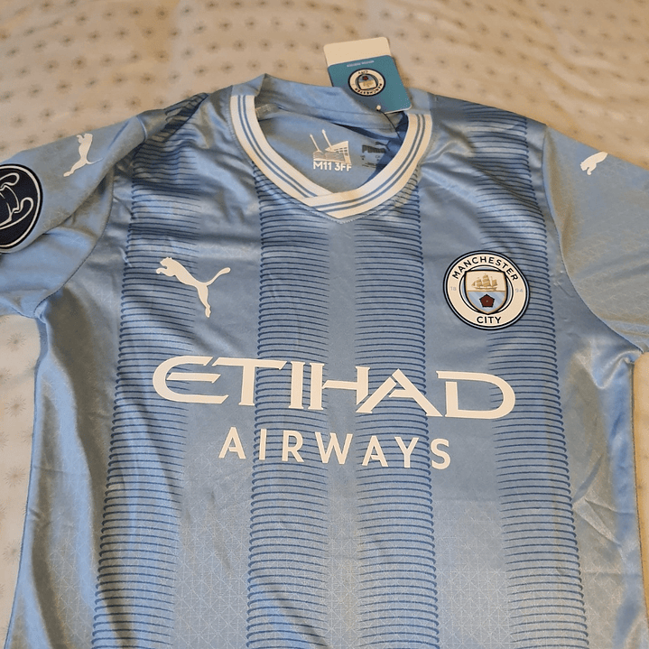 Camiseta  Manchester City  F. C.  Hombre Local  23/24 Versión Jugador con Parche UCL  Talla 