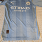Camiseta  Manchester City  F. C.  Hombre Local  23/24 Versión Jugador con Parche UCL  Talla 