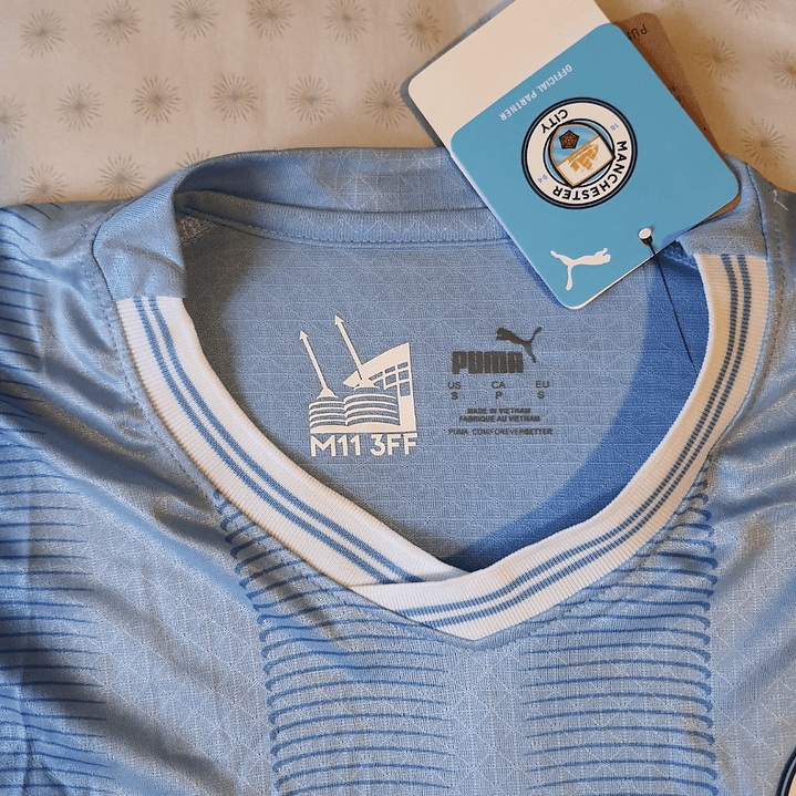 Camiseta  Manchester City  F. C.  Hombre Local  23/24 Versión Jugador con Parche UCL  Talla 