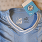 Camiseta  Manchester City  F. C.  Hombre Local  23/24 Versión Jugador con Parche UCL  Talla 