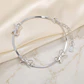 Pulsera plata delicada brillante con lazos - Miniatura 2