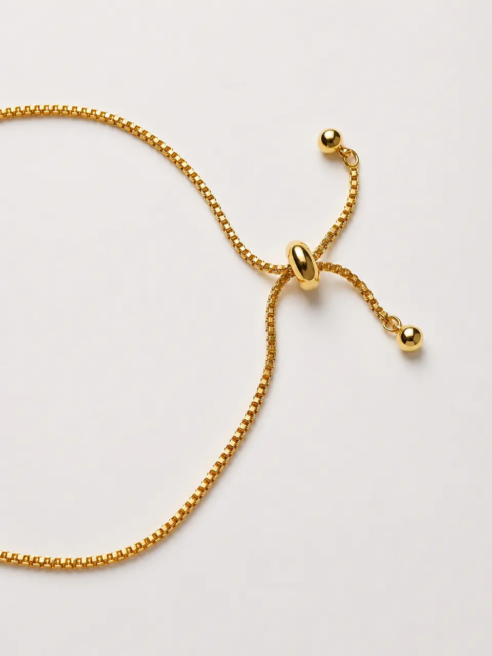 Brazalete chapado en oro con moño de circonita 4